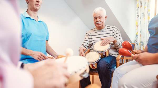 A group of people playing musical instruments in a medical setting